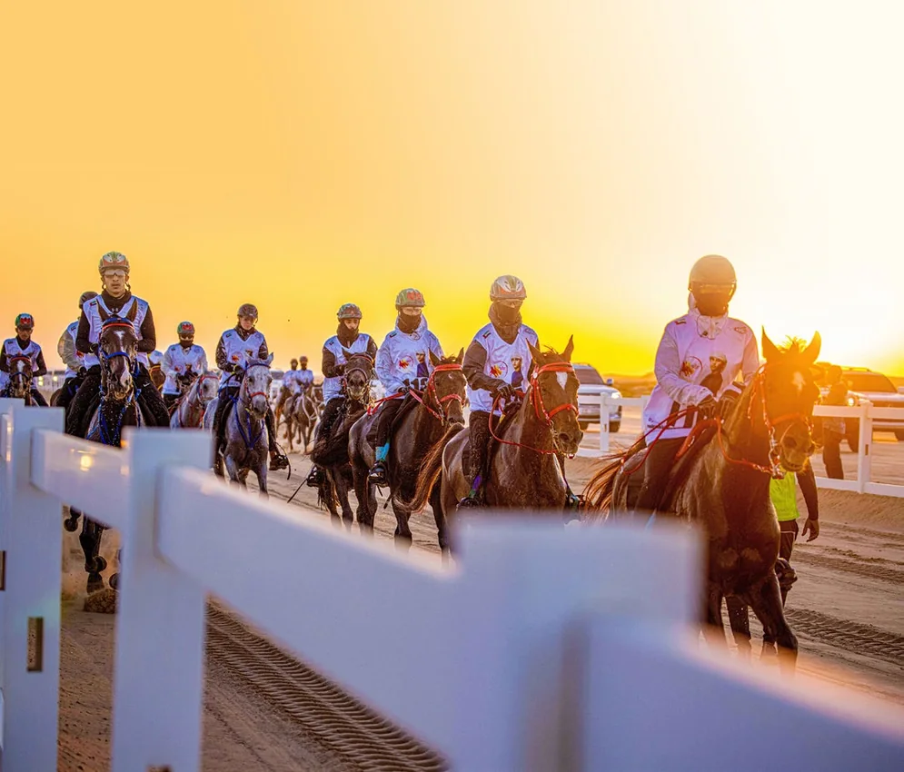 EIEV endurance riders at golden sunset